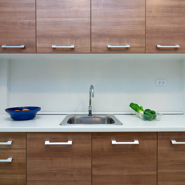 Stone and laminate countertops paired with custom cabinets in Cedar Park, TX