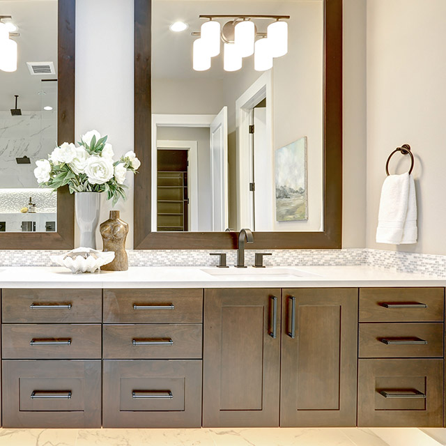 Stone and laminate countertops matched with custom cabinets in Leander