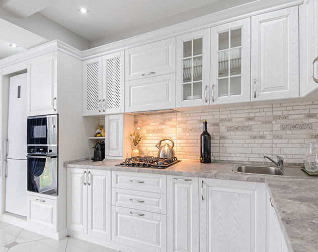 Natural wood cabinet doors with soft-close hinges in Leander, TX